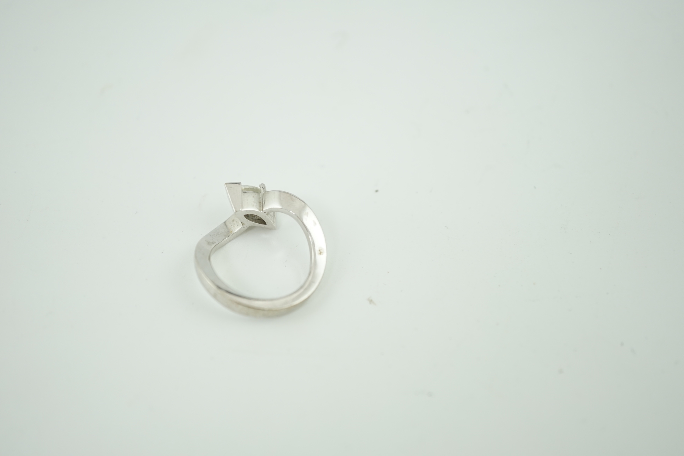 A modern 18ct white gold and solitaire marquise cut diamond set ring